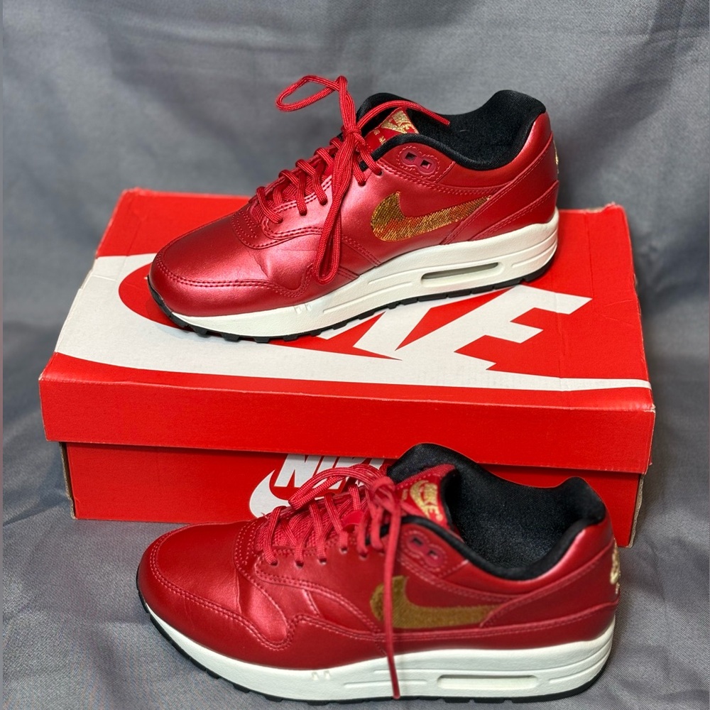 Nike Air Max 1 in University Red and Metallic Gold
